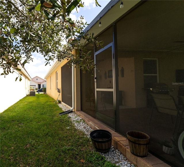 view of yard with a sunroom