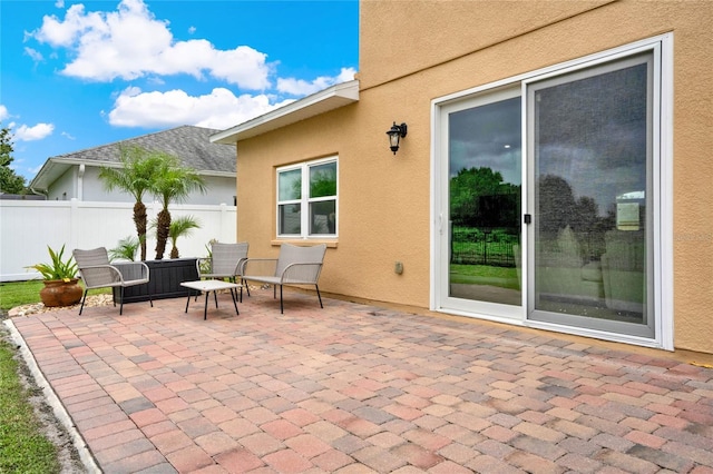 view of patio / terrace featuring fence