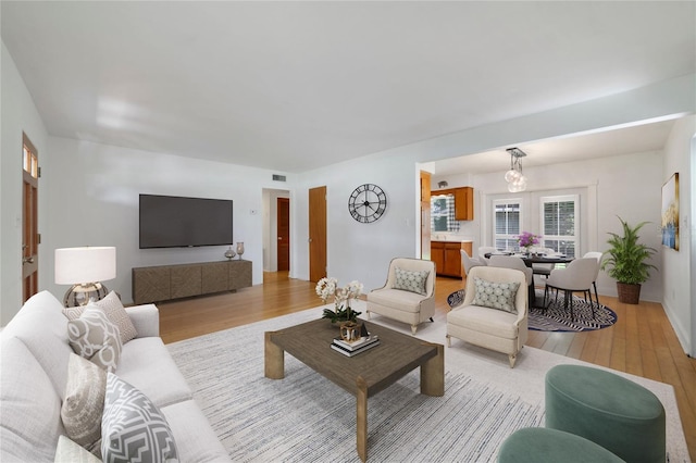 living room with light hardwood / wood-style floors