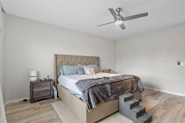 bedroom featuring ceiling fan and light hardwood / wood-style floors