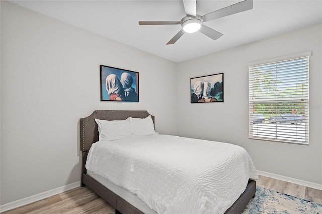 bedroom featuring ceiling fan and light hardwood / wood-style floors