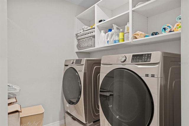 laundry area with washing machine and dryer