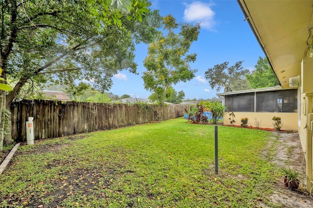 view of yard with a sunroom