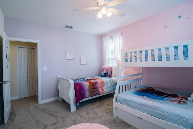 carpeted bedroom with ceiling fan