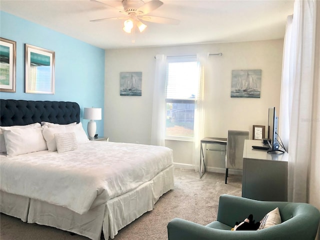 bedroom featuring ceiling fan and light colored carpet