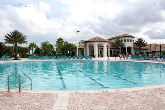 view of swimming pool with a patio