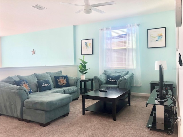 carpeted living room featuring ceiling fan