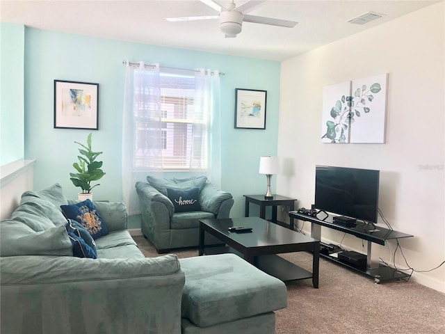 living room with carpet floors and ceiling fan