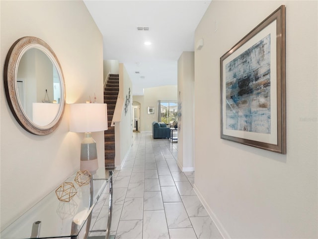 8938 Cabot Cliffs Dr, Davenport, FL 33896 - hall featuring stairs, light marble finish flooring, baseboards, and recessed lighting