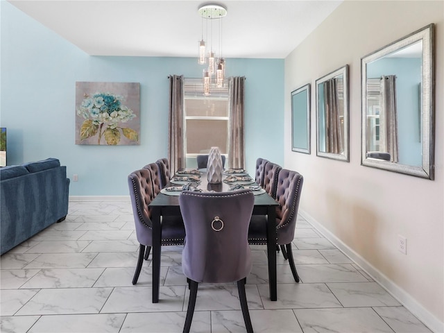 8938 Cabot Cliffs Dr, Davenport, FL 33896 - dining area featuring light marble finish floors and baseboards