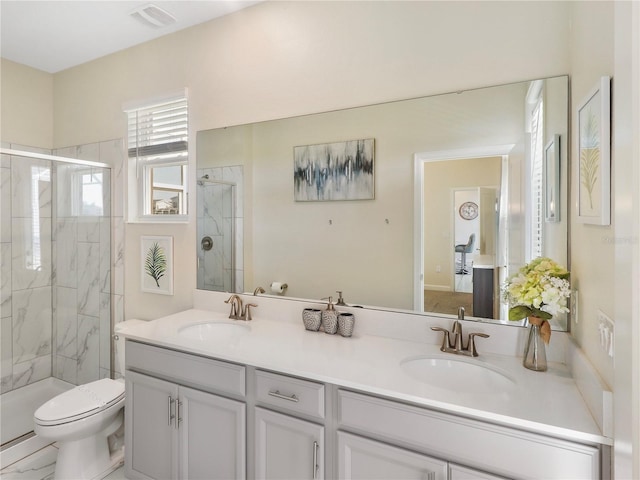 8938 Cabot Cliffs Dr, Davenport, FL 33896 - full bath with a stall shower, toilet, and double vanity