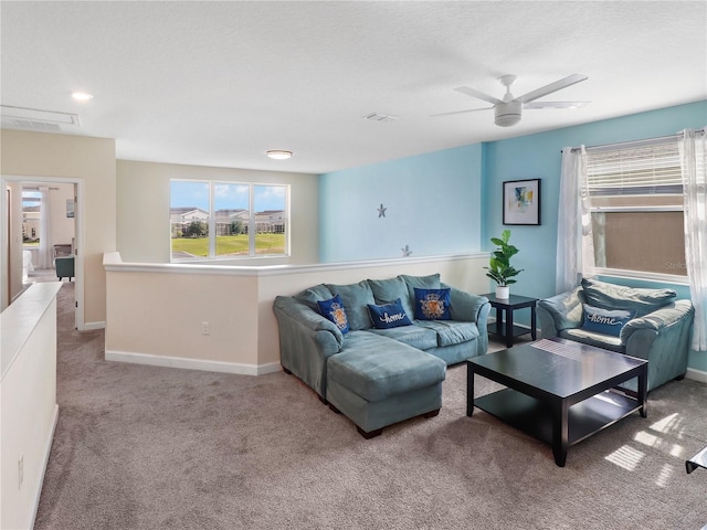 8938 Cabot Cliffs Dr, Davenport, FL 33896 - living room with carpet floors, a ceiling fan, and baseboards