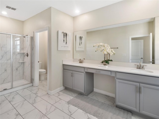 8938 Cabot Cliffs Dr, Davenport, FL 33896 - full bath with toilet, a marble finish shower, marble finish flooring, baseboards, and double vanity