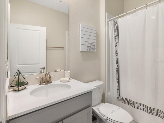 8938 Cabot Cliffs Dr, Davenport, FL 33896 - full bathroom with vanity, toilet, and a shower with shower curtain