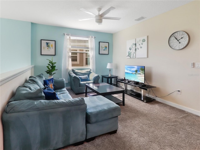 8938 Cabot Cliffs Dr, Davenport, FL 33896 - living area with carpet, a ceiling fan, and baseboards