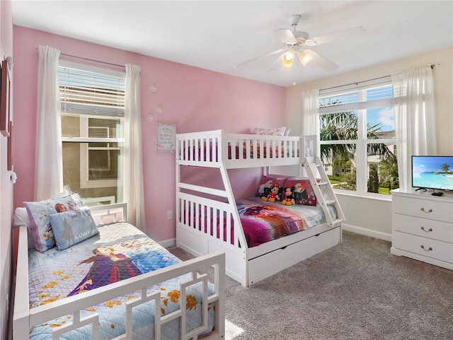 8938 Cabot Cliffs Dr, Davenport, FL 33896 - carpeted bedroom with multiple windows, baseboards, and ceiling fan