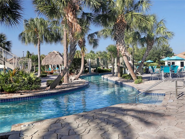 8938 Cabot Cliffs Dr, Davenport, FL 33896 - community pool featuring a patio