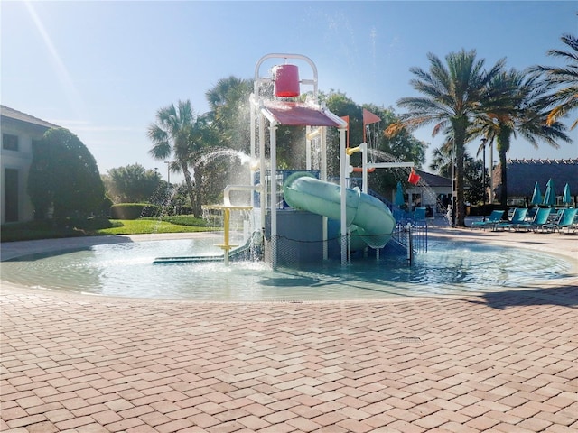 8938 Cabot Cliffs Dr, Davenport, FL 33896 - view of pool with a water play area and a water slide