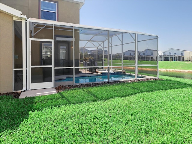 8938 Cabot Cliffs Dr, Davenport, FL 33896 - view of grassy yard with a pool with connected hot tub