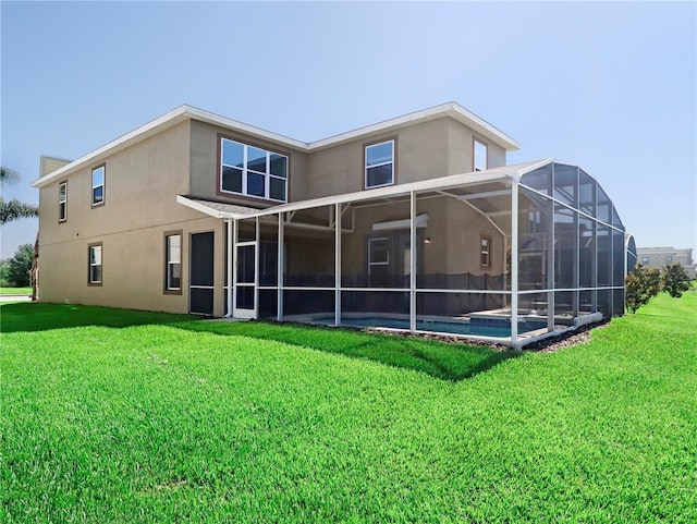 8938 Cabot Cliffs Dr, Davenport, FL 33896 - back of house featuring an outdoor pool, a yard, stucco siding, and glass enclosure