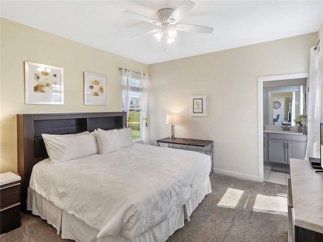 8938 Cabot Cliffs Dr, Davenport, FL 33896 - bedroom featuring carpet, baseboards, ensuite bathroom, and ceiling fan