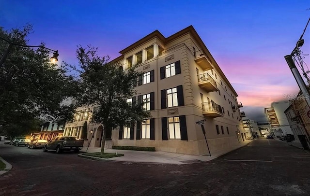 view of outdoor building at dusk