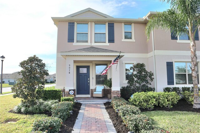 view of front of home with a front lawn