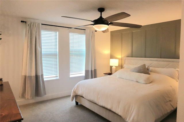 bedroom featuring ceiling fan and carpet floors