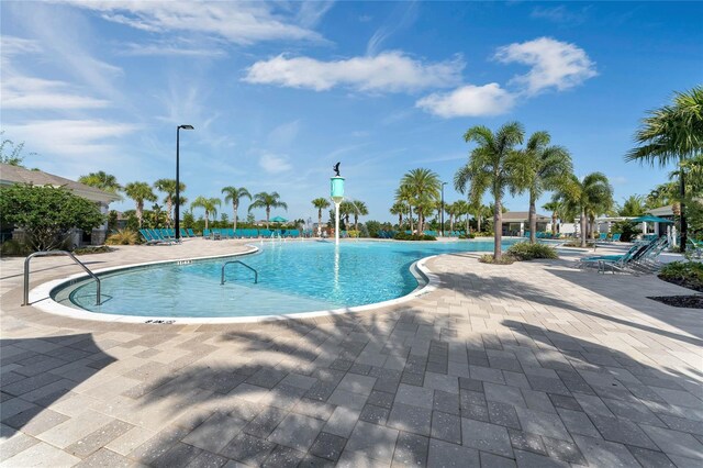 view of swimming pool featuring a patio area