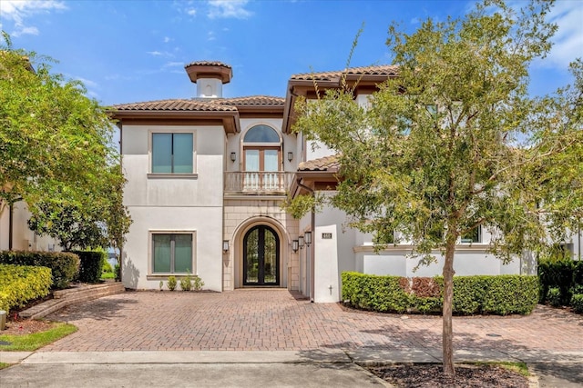 mediterranean / spanish house with french doors