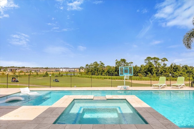 view of pool featuring an in ground hot tub