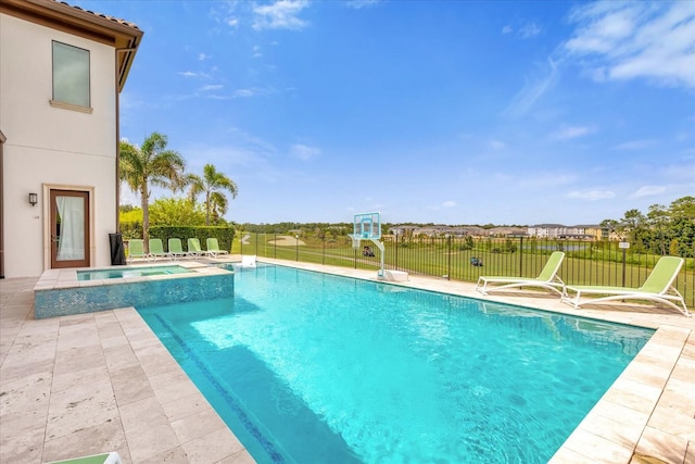 view of pool with an in ground hot tub and a patio area