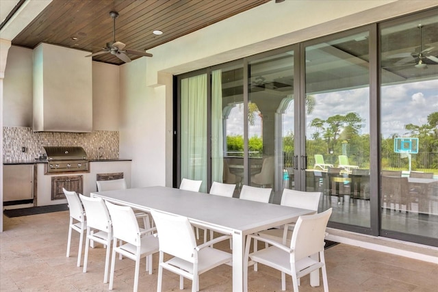 view of patio / terrace featuring ceiling fan, grilling area, and an outdoor kitchen