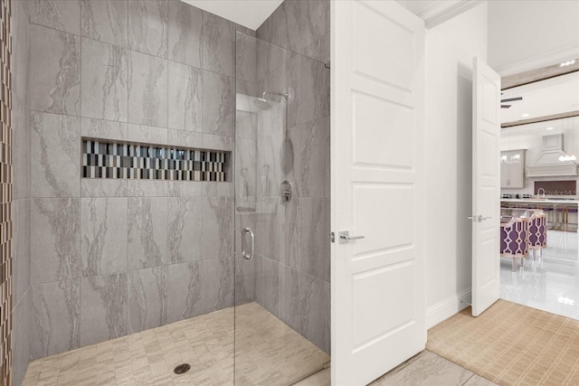 bathroom featuring tile patterned flooring and an enclosed shower