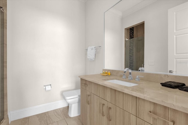 bathroom with vanity, tile patterned floors, walk in shower, crown molding, and toilet