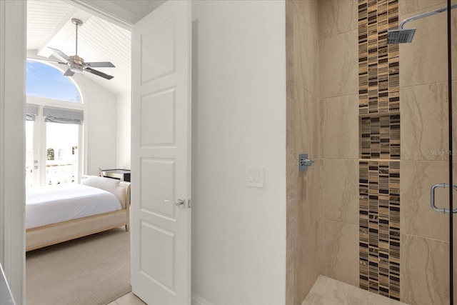 bathroom featuring a shower with door, lofted ceiling with beams, and ceiling fan