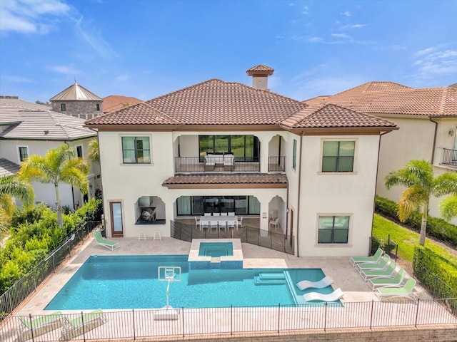 back of house with a patio, area for grilling, and a fenced in pool