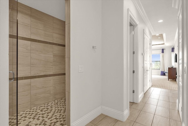 interior space featuring ornamental molding and light tile patterned flooring