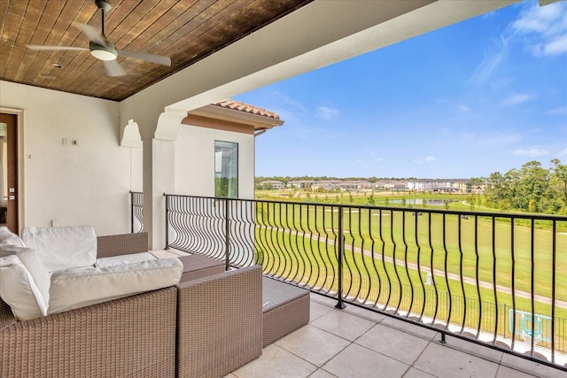 balcony featuring an outdoor living space and ceiling fan