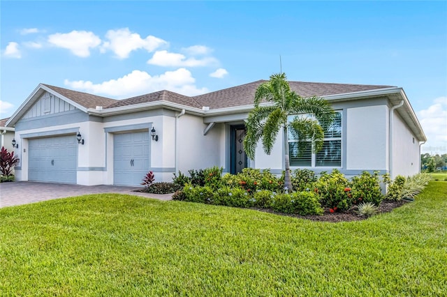 single story home with a front yard and a garage