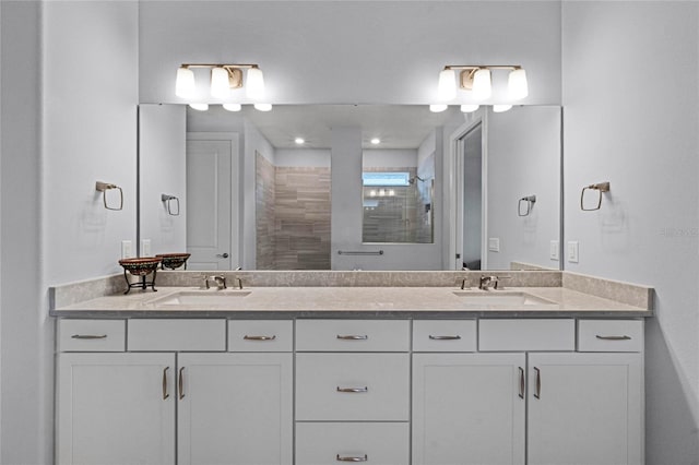 bathroom featuring vanity and a shower