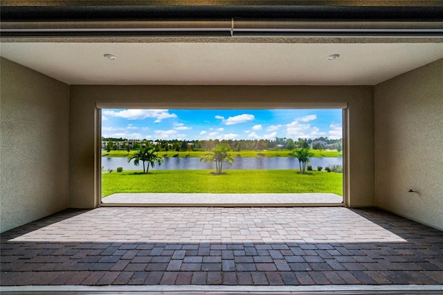 view of patio featuring a water view