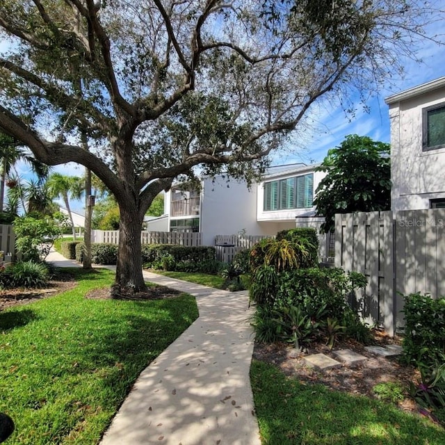 exterior space featuring a fenced front yard and a yard