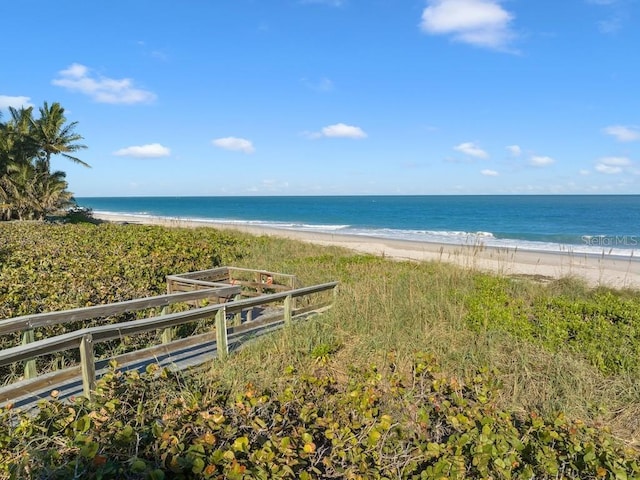 property view of water featuring a beach view