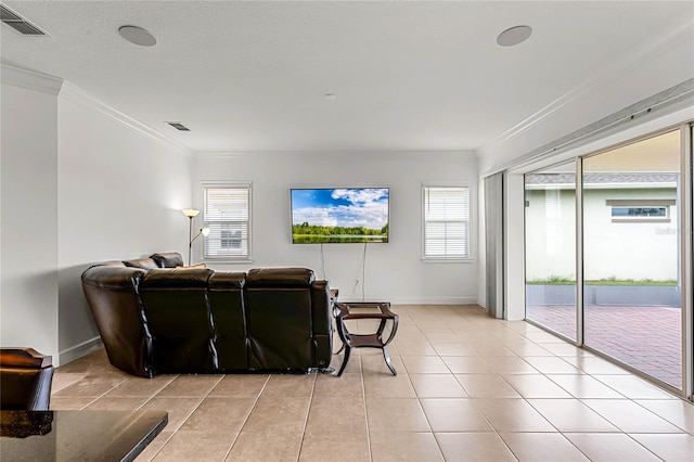 living room with light tile patterned flooring and ornamental molding