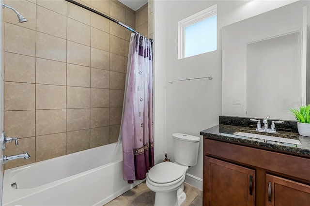 full bathroom with vanity, shower / tub combo, and toilet