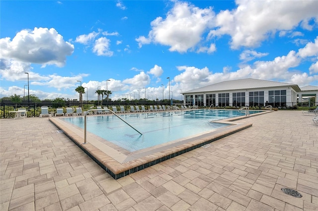 view of swimming pool with a patio area