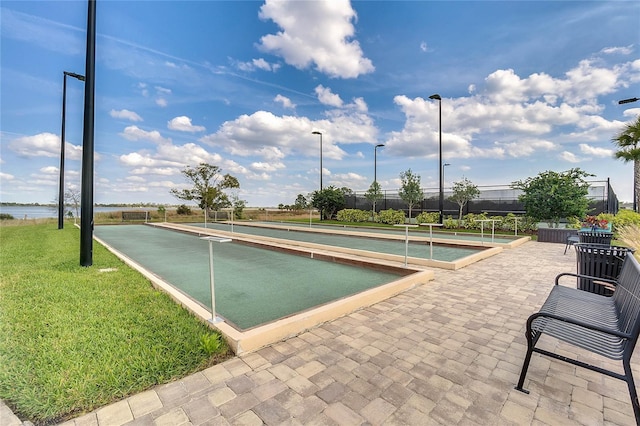 view of pool featuring a yard