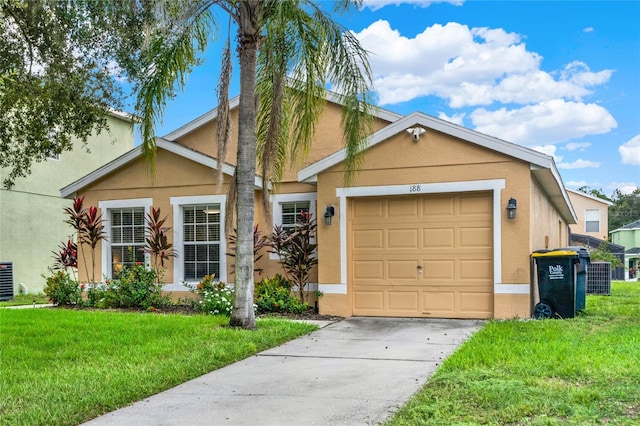 view of front of house featuring a front yard and a garage