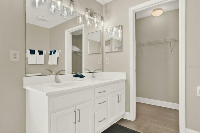 bathroom with wood-type flooring and vanity